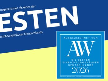 Blaue und gelbe Grafik mit dem großen Text BESTEN und einem blauen Kasten mit der Aufschrift AW Die besten Einrichtungshäuser Deutschlands 2026. Möbel Braum ist unter den Top 50 der besten Einrichtungshäuser Deutschlands gelistet.